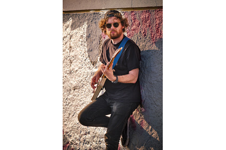 Street musician playing electric, a Person Photo by f9photos