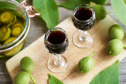 Glasses of homemade nut liqueur with unripe walnuts, a Food & Drink Photo by Madeleine Steinbach