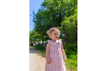 Child girl in the summer in the park, a Person Photo by yanadjana