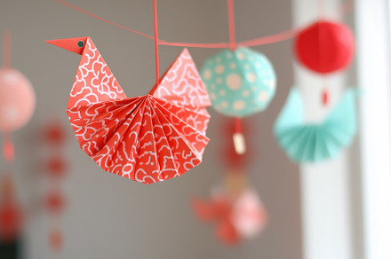Colorful paper decorations including a red origami bird and round paper lantern, an Arts & Entertainment Photo by Textures & Backgrounds