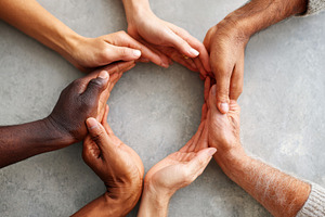 Diverse hands forming a circle symbolizing unity, a Person Photo by AlyaAnd