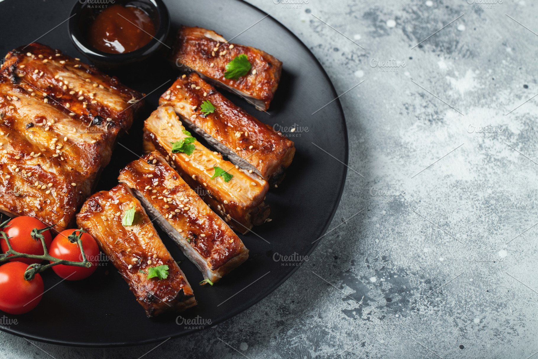 Closeup of pork ribs grilled with BBQ sauce and caramelized in honey., a Food & Drink Photo by Budarinphoto
