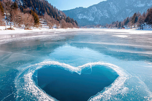 Heart-shaped ice hole on a frozen lake, a Nature Photo by AlyaAnd