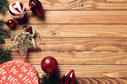 Vintage Christmas background with gift box, red baubles, star, fir branches on, a Holiday Photo by photoguns