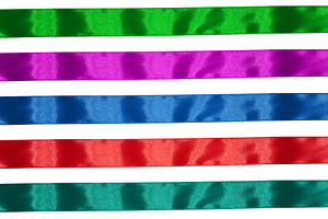 Blue, purple, green and red textile silk ribbon isolated on whit, a Holiday Photo by ndanko