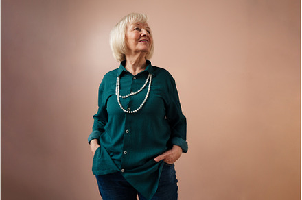 Smiling elegant elderly woman on, a Person Photo by HalfPoint