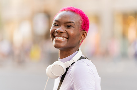 Portrait of an african young woman smiling, a Person Photo by Iván Moreno STOCK PHOTO