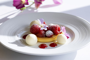 Gourmet raspberry tart featuring fresh raspberries, white chocolate spheres, be, a Photo by Studio ANNA