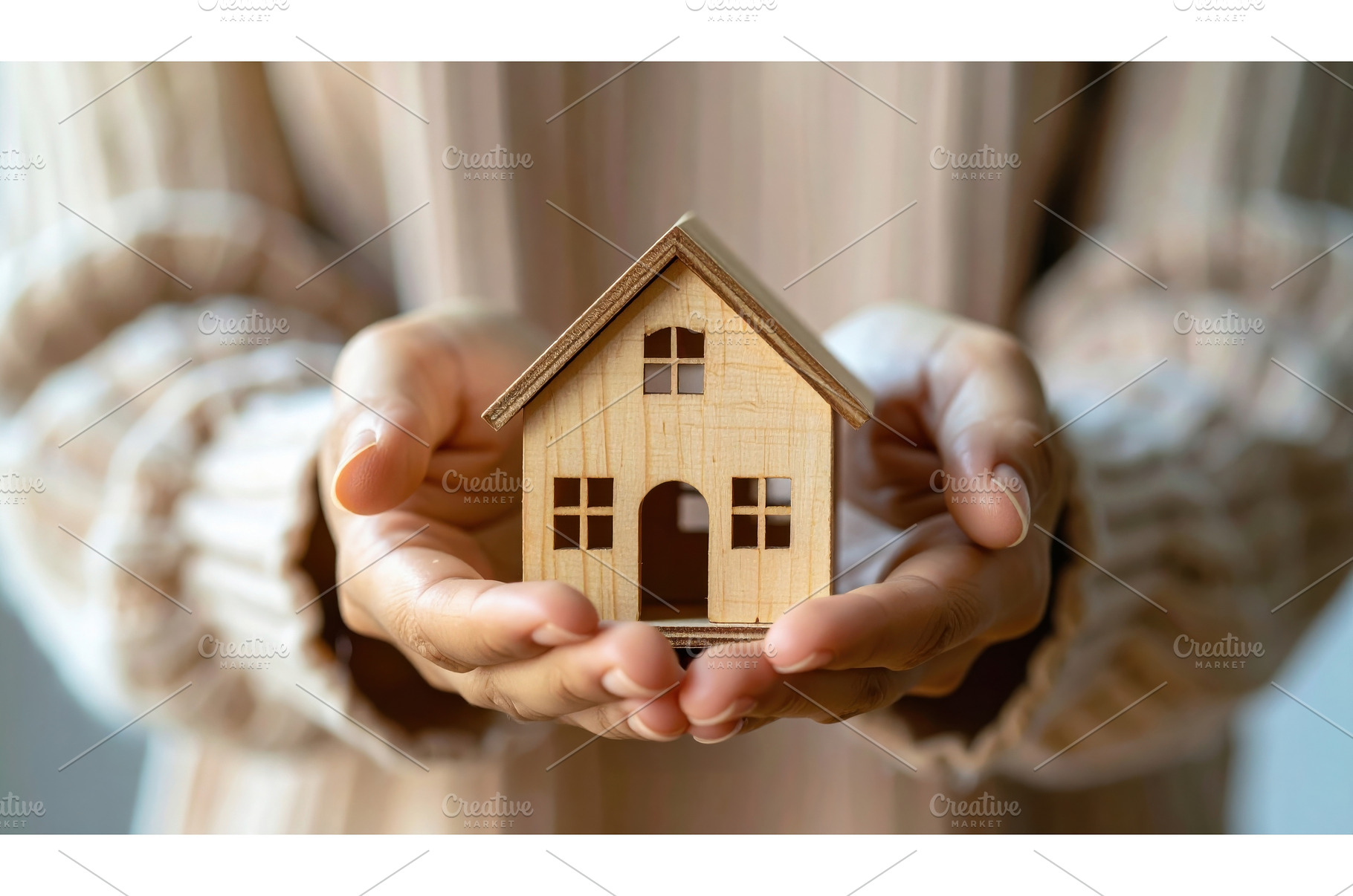 Hands holding a small wooden house, a Business Photo by Igor Tichonow