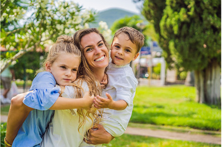 Happy family outdoors on the grass, a Person Photo by Elizaveta Galitskaya