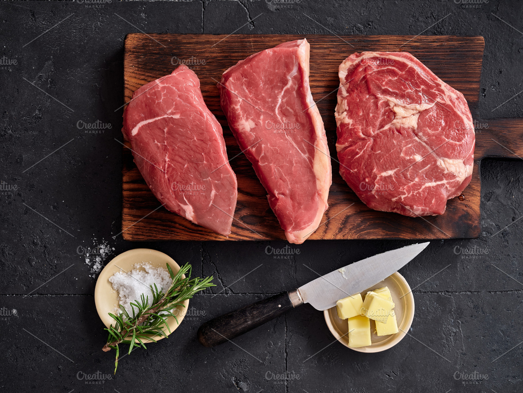 Rib-eye, roast beef, flank and rump steak on wooden cutting board with knife, s, a Food & Drink Photo by Asya Nurullina