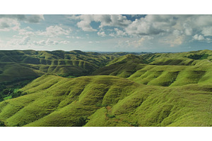 Aerial view of rolling green hills, a Nature Photo by Goinyk