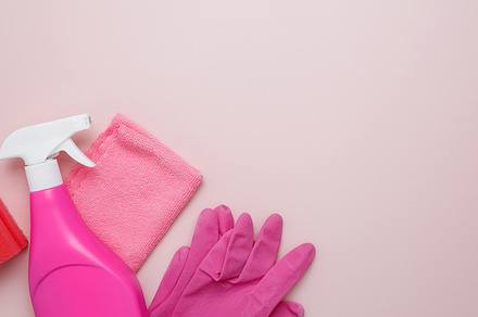 Household cleaning and hygiene concept. Pink cleaning supplies including rubber, a Photo by matucha