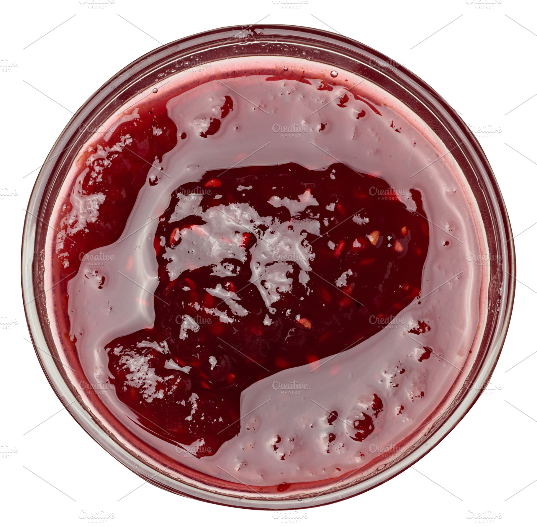 Raspberry jam in a glass bowl on isolated background, a Food & Drink Photo by ndanko
