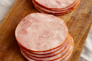 Organic Smoked Cold Cuts Deli Meat Ham on a wooden board, side v, a Food & Drink Photo by LiudmylaChuhunova