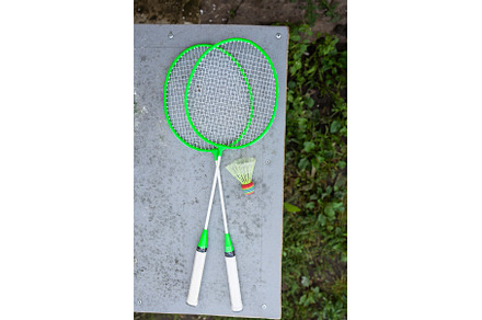 Green badminton rackets on the table, a Sports & Recreation Photo by Artsaba Family