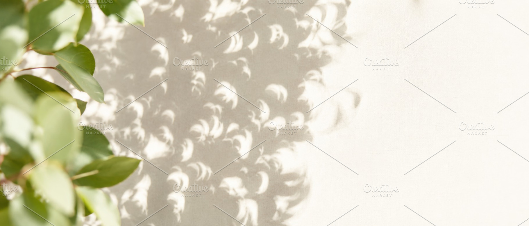Solar eclipse shapes on wall create, a Photo by Dvoevnore photos