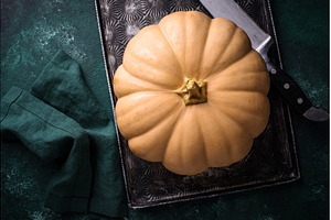 Raw fresh cut pumpkin on dark, a Food & Drink Photo by Yulia Furman