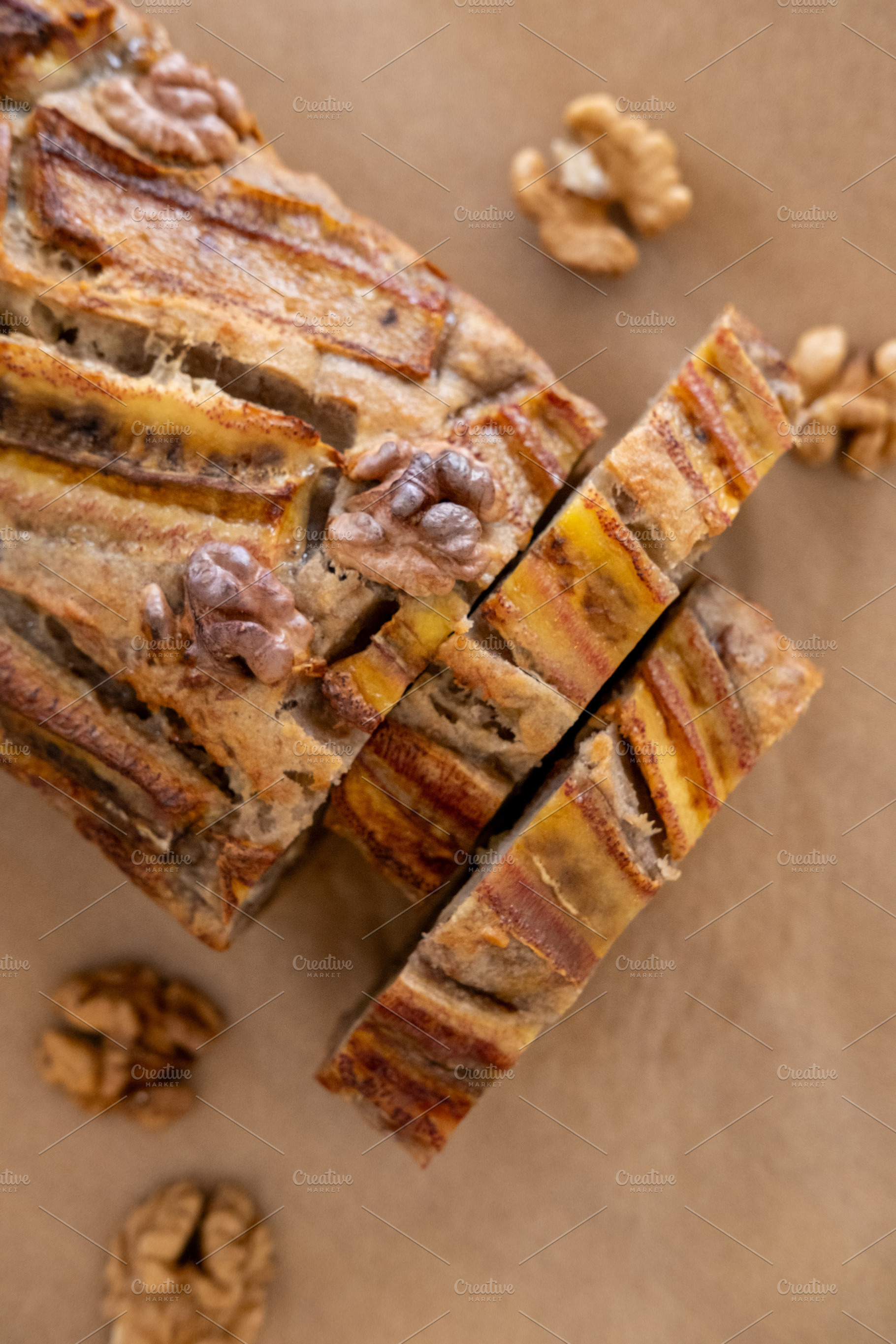 Pastry background banana bread served cut pieces, a Food & Drink Photo by Photo Drive Studio