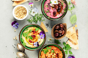 Gourmet Hummus Trio with Fresh Ingredients and Edible Flowers, a Food & Drink Photo by Natalia Klenova's Shop