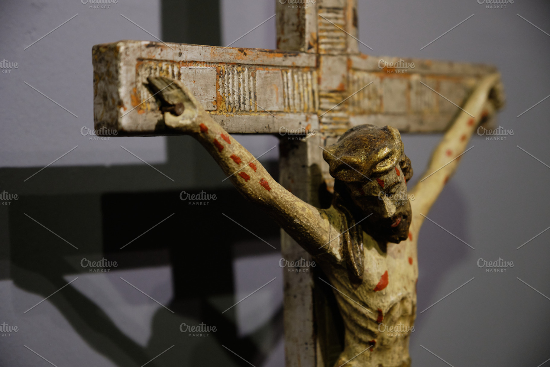 Vintage wooden crucifixion statue of Jesus Christ on a cross. Ancient religious, an Arts & Entertainment Photo by Rohan Photography