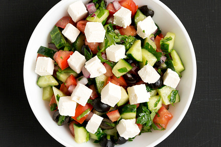 Homemade Shepherd's salad with cucumbers, feta and parsley in a, a Food & Drink Photo by LiudmylaChuhunova
