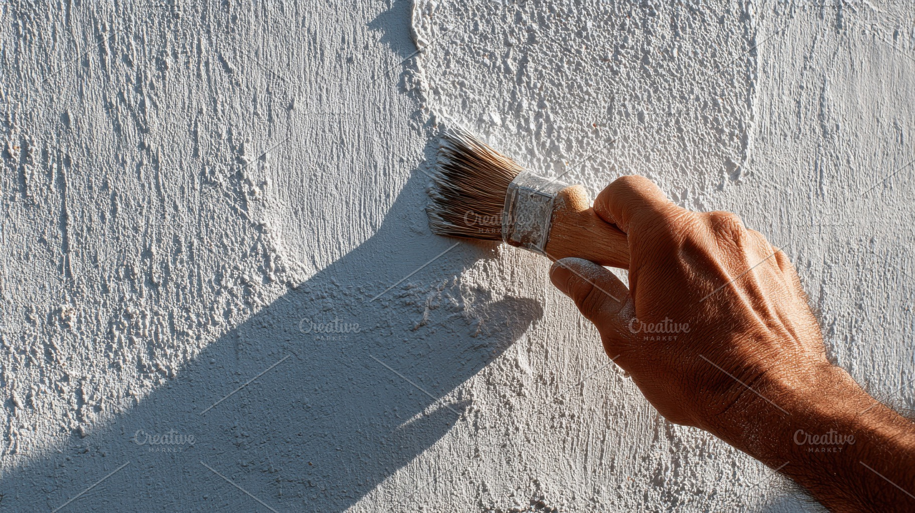 Painting a wall in sunlight, a Photo by Beautiful things