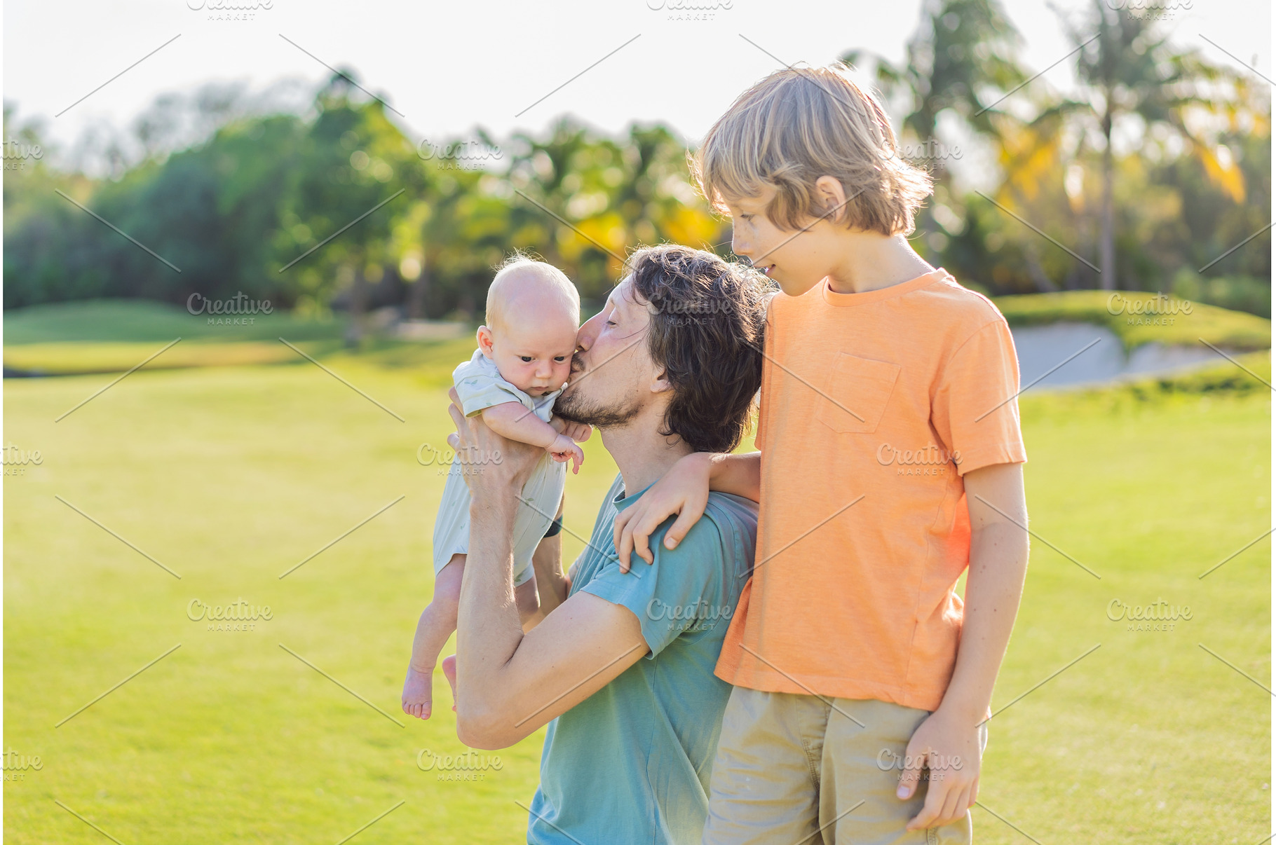 Father, older son, and newborn baby, a Person Photo by Elizaveta Galitskaya
