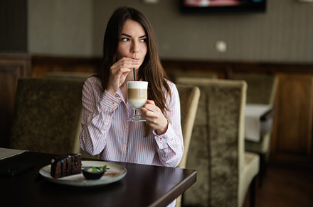 Young beautiful brunette woman sit in coffee shop cafe restauran, a Person Photo by AS photostudio