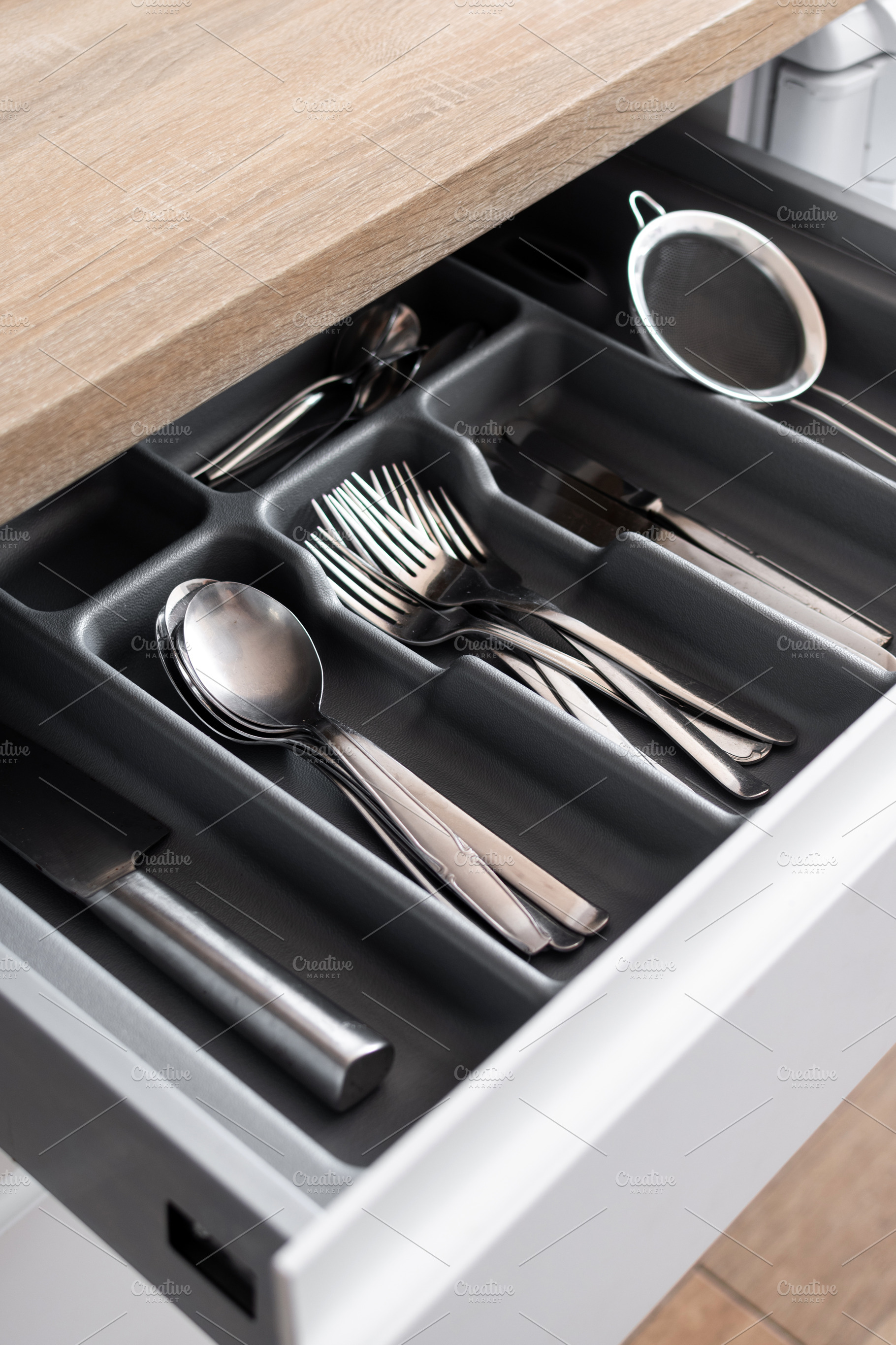 Organized cutlery drawer with kitchen utensils, a Food & Drink Photo by etorres69