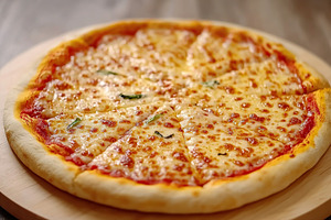 Baked pizza Margherita with melted mozzarella and fresh basil slices on wooden, a Food & Drink Photo by AlyaAnd