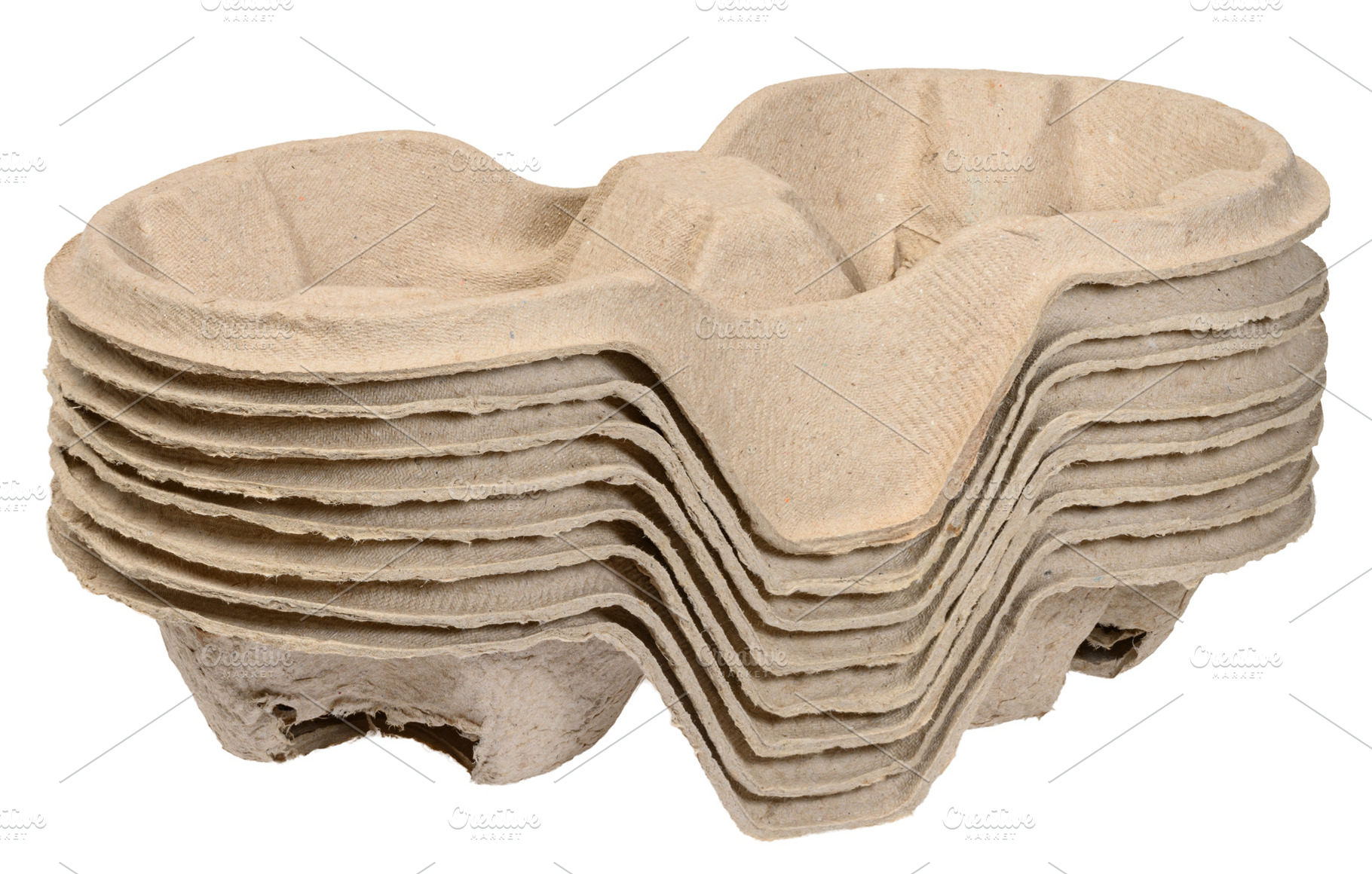 A stack of cardboard cup holders for coffee and drinks, made fro, a Food & Drink Photo by ndanko