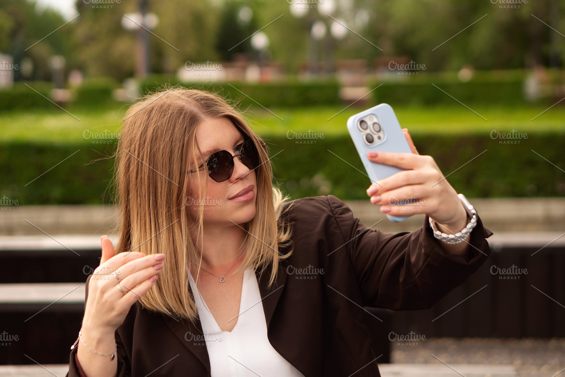 Young woman smiling with sunglasses, a Person Photo by Elena Vagengeim