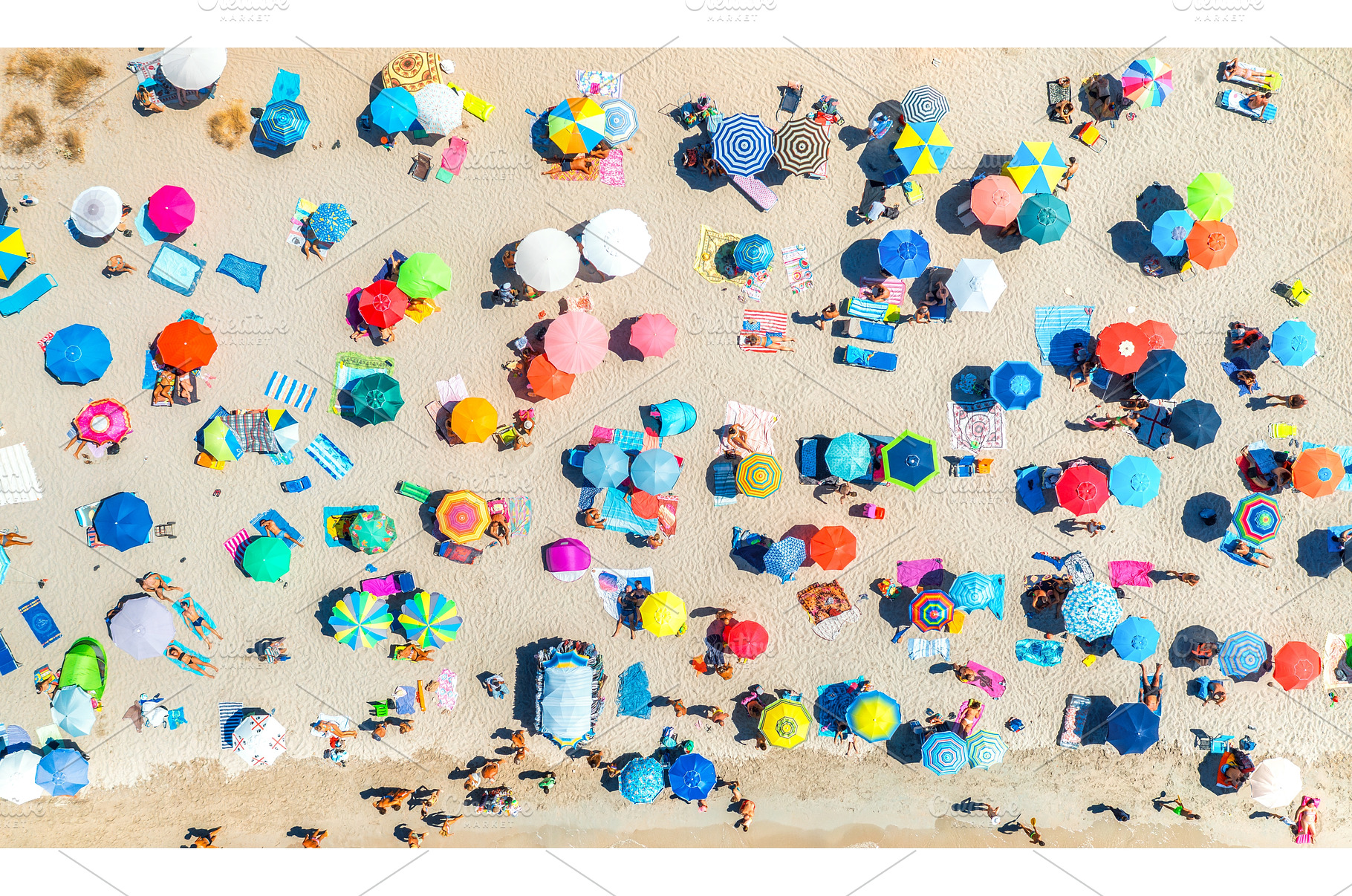 Aerial view of colorful umbrellas on, a Holiday Photo by den-belitsky