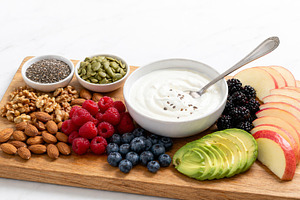 Breakfast grazing board with yogurt,, a Photo by Dvoevnore photos