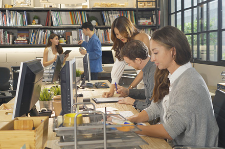 A group of multi ethnic business team talk, communicate, discuss, a Photo by Tampatra