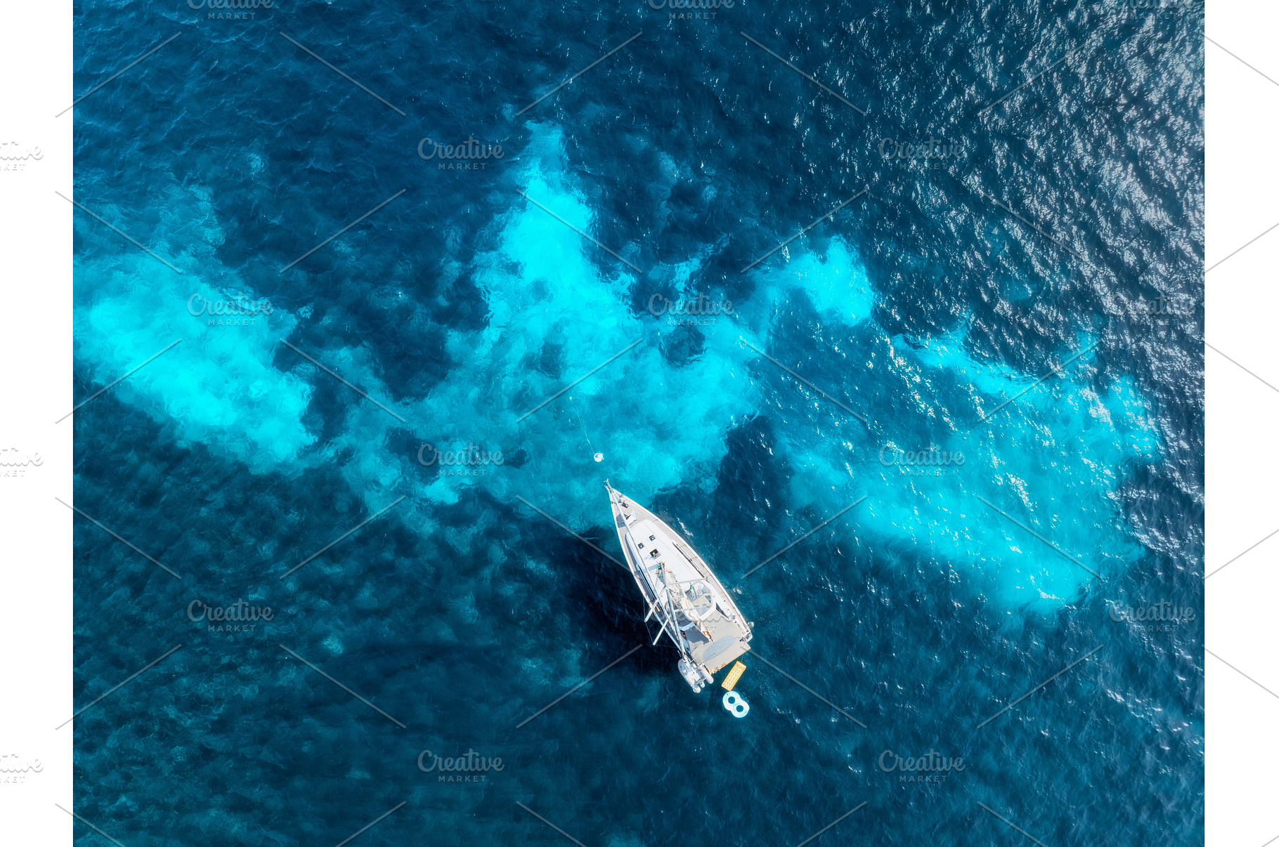 Aerial view of a yacht in the, a Nature Photo by den-belitsky