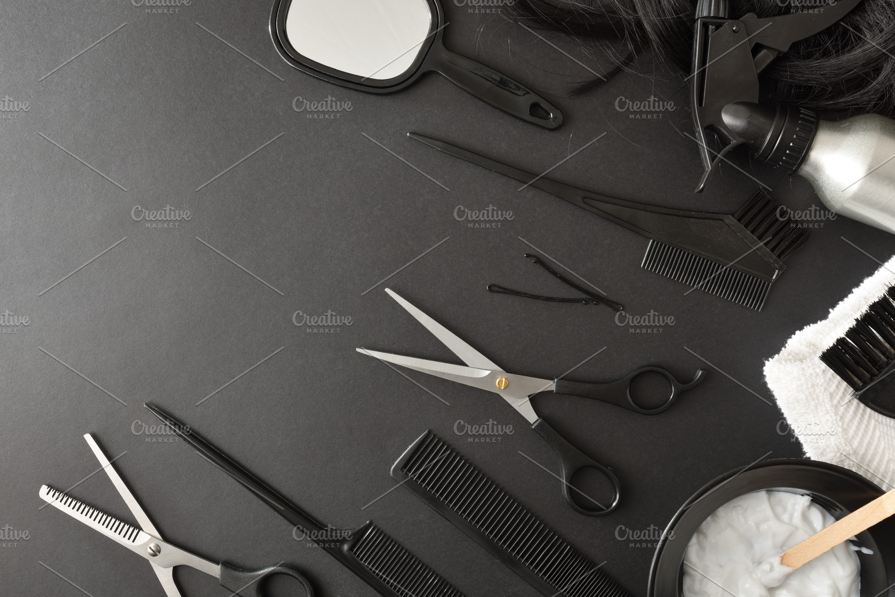 Set of hairdressing tools and styling on black table, a Business Photo by Davizro's Market