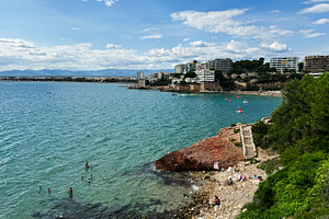 Coastal view of La Pineda beach in Tarragona, Spain on a sunny day, a Photo by AS photostudio