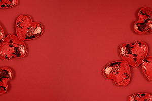 A multitude of glittery red decorative hearts are arranged on th, a Holiday Photo by ndanko
