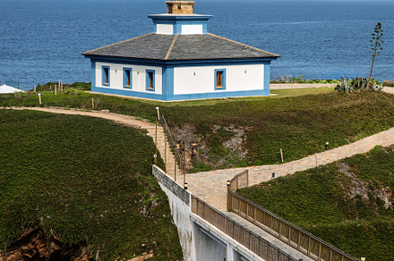 Lighthouse on an islet with a bridge, a Holiday Photo by Perpis