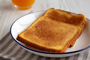 Homemade American Cinnamon Toast with Butter and Orange Juice, l, a Food & Drink Photo by LiudmylaChuhunova