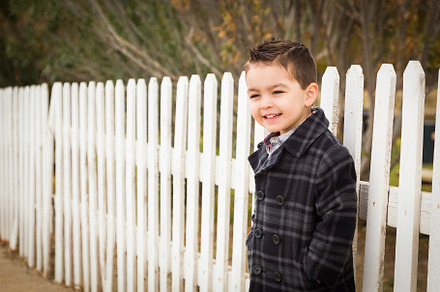 Young mixed race boy waiting for sch containing ethnic, race, and latino, a Person Photo by Andy Dean Photography