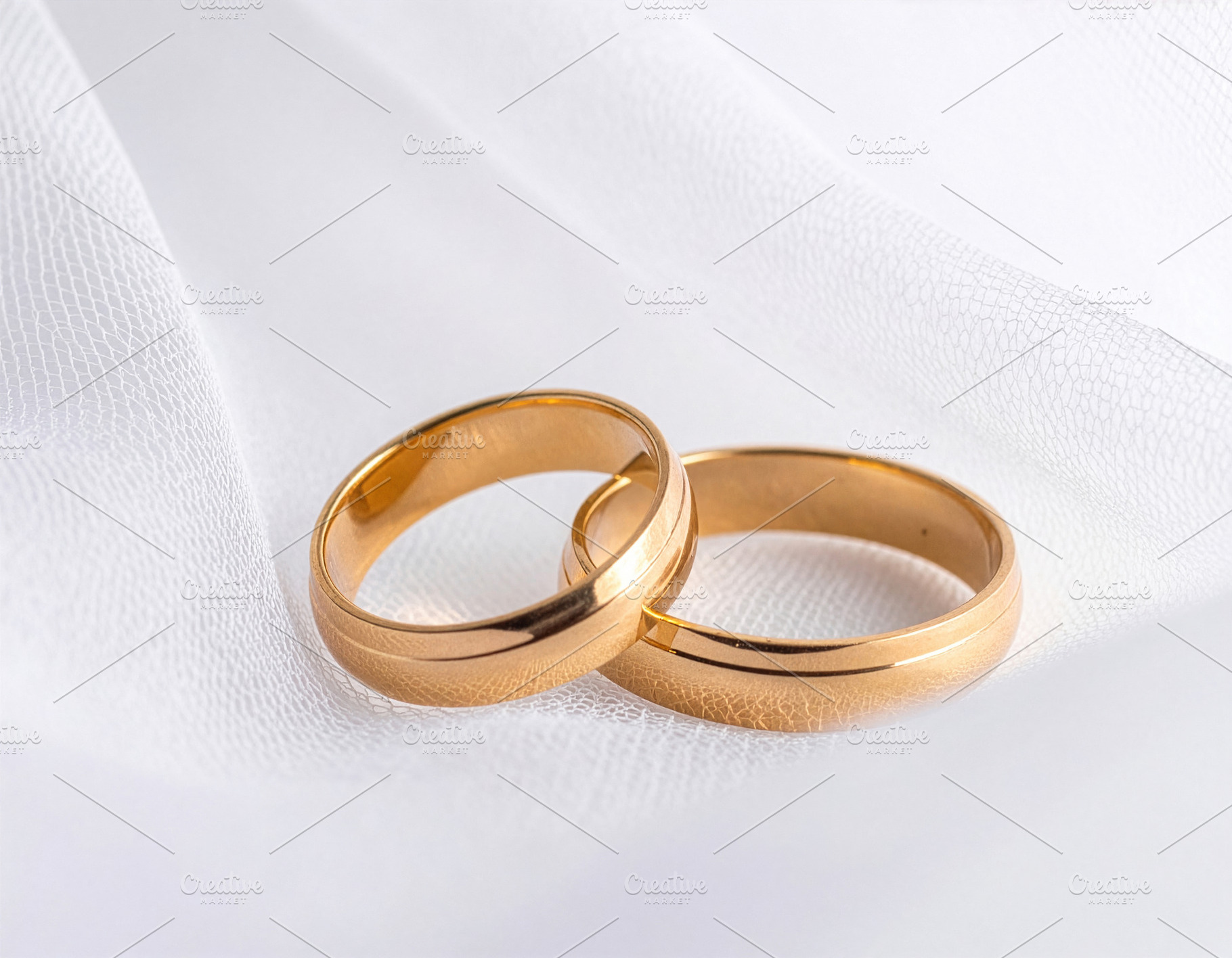 Plain Gold Wedding Rings on White Fabric, a Holiday Photo by Davizro's Market