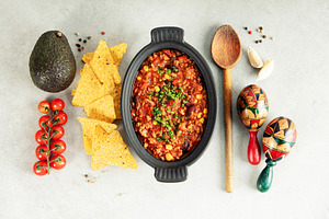 Mexican Chili Con Carne with Avocado, Peppers, and Maracas, a Food & Drink Photo by Natalia Klenova's Shop