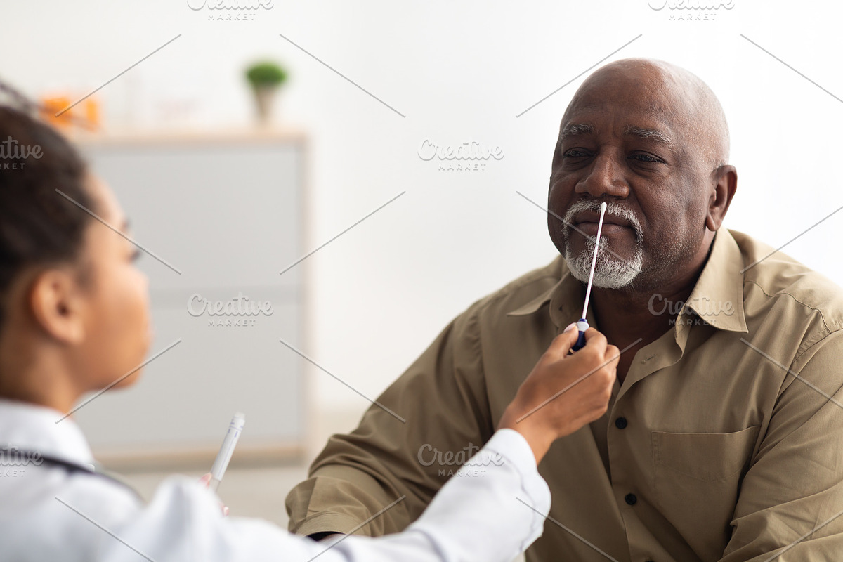Doctor taking PCR test sample from potentially infected mature man, a Photo by Prostock-Studio (Photo 2 of 2)