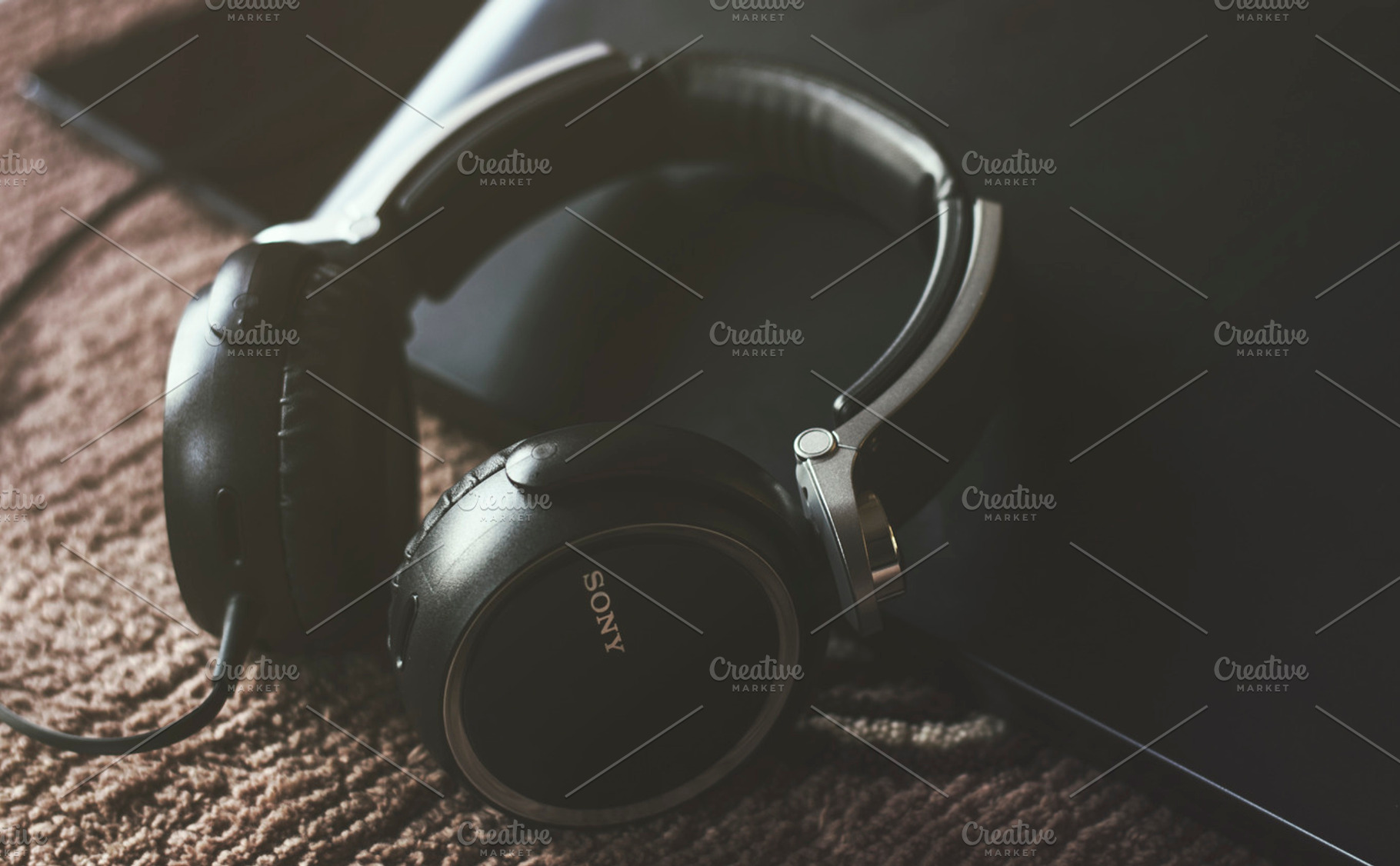 Headphones Inclined on Laptop, a Technology Photo by Shots By RC