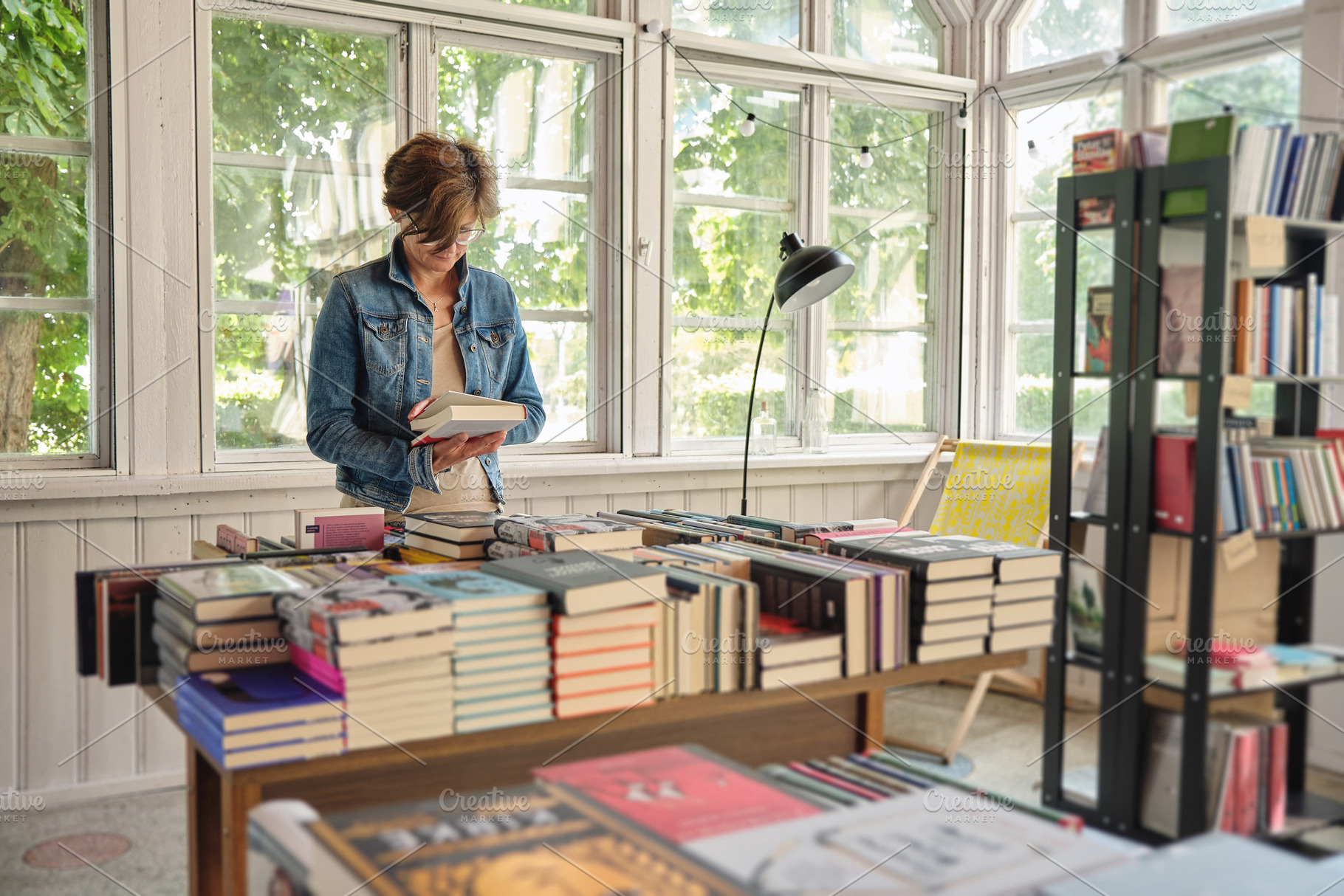 Vintage bookshop with lonely woman, a Person Photo by BOOCYS