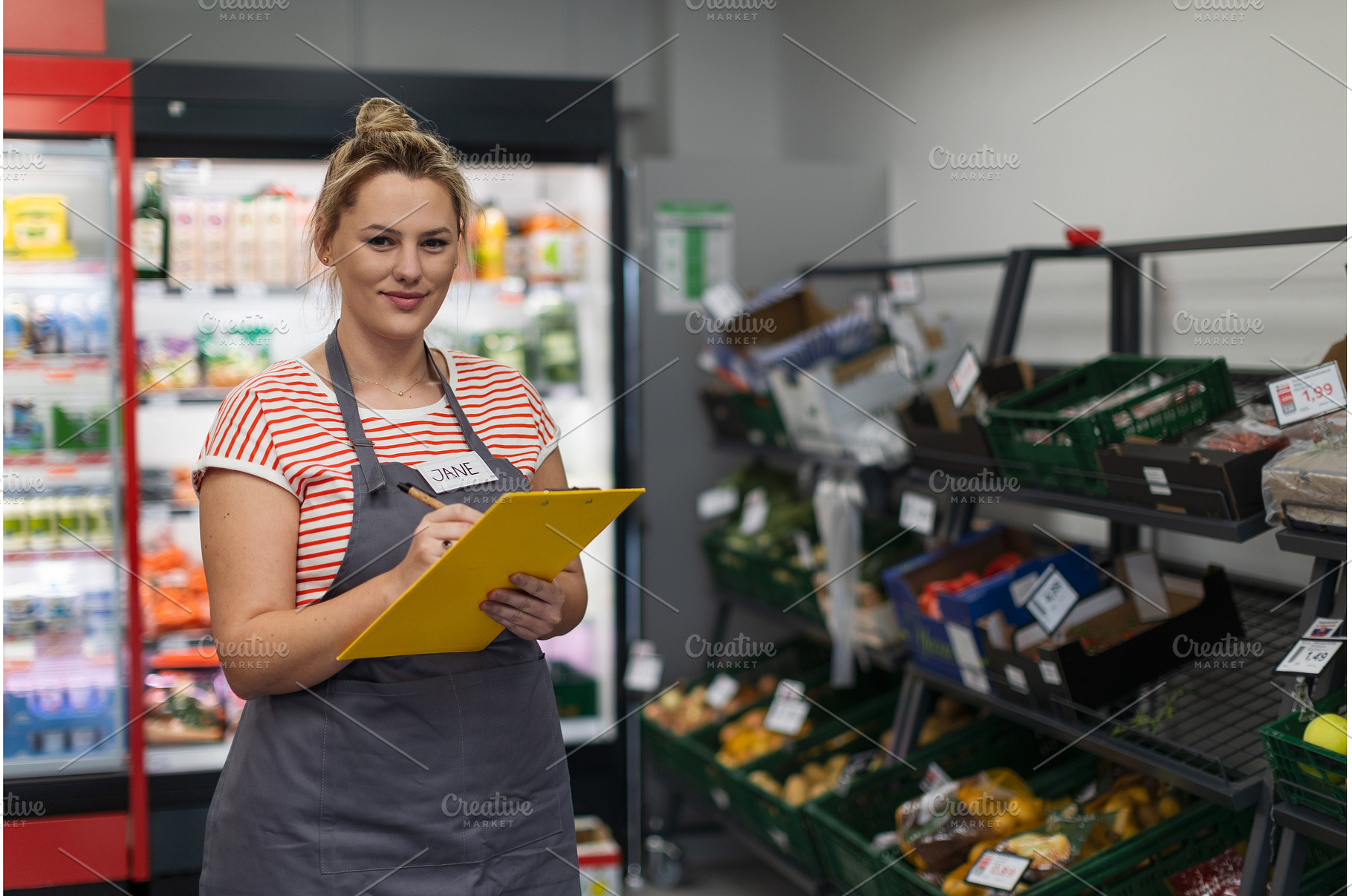 A young shop assistant in, a Person Photo by HalfPoint