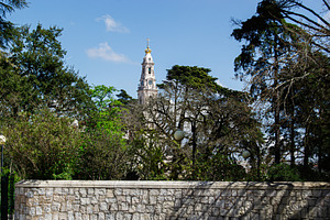 Historic church tower and lush greenery in the heart of Fatima, Portugal, a Photo by AS photostudio